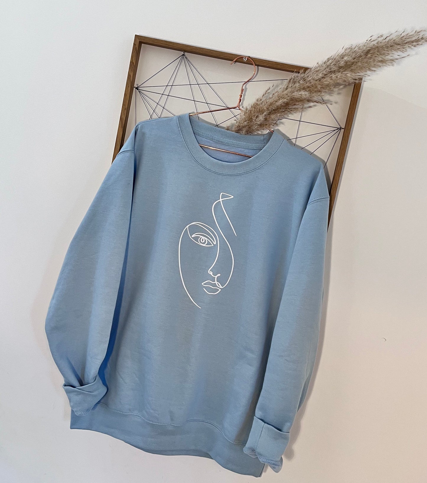 Women’s face pale blue sweater | Sketched face | fashion sweater | Picasso style sketch | line face drawing
