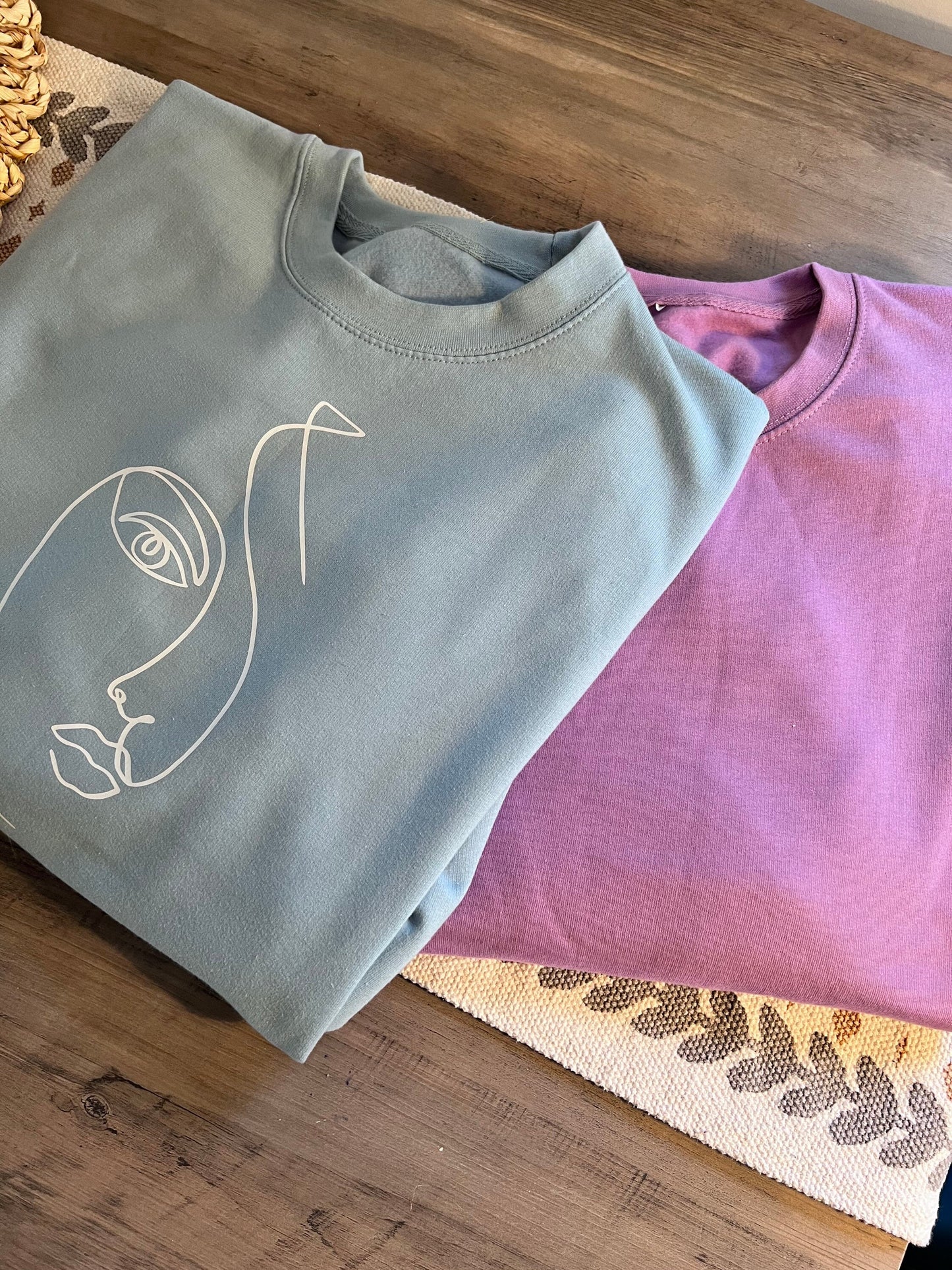 Women’s face pale blue sweater | Sketched face | fashion sweater | Picasso style sketch | line face drawing