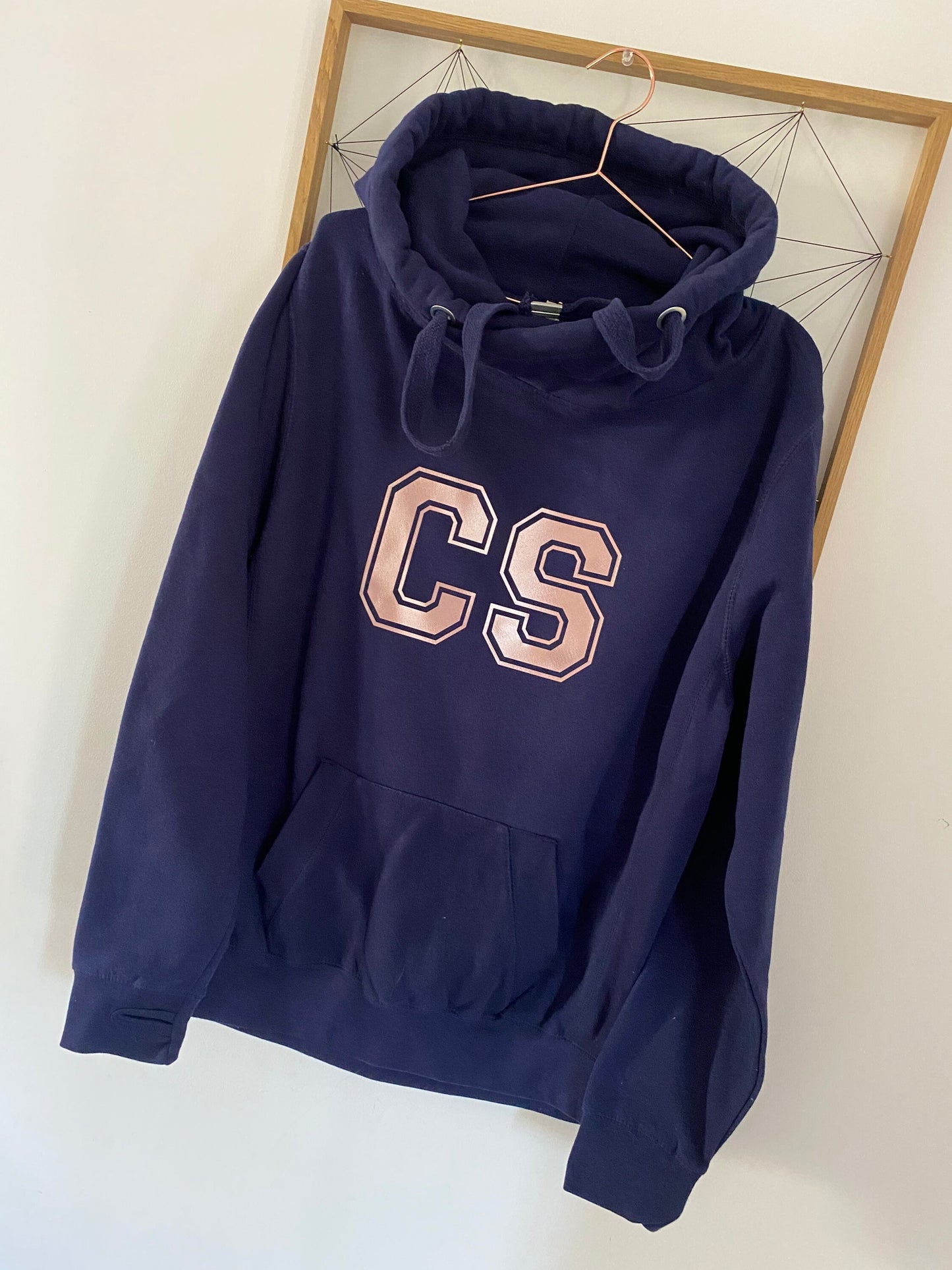 Personalised varsity initial cross over hoodie with thumb holes and front pocket available in a choice of colours.