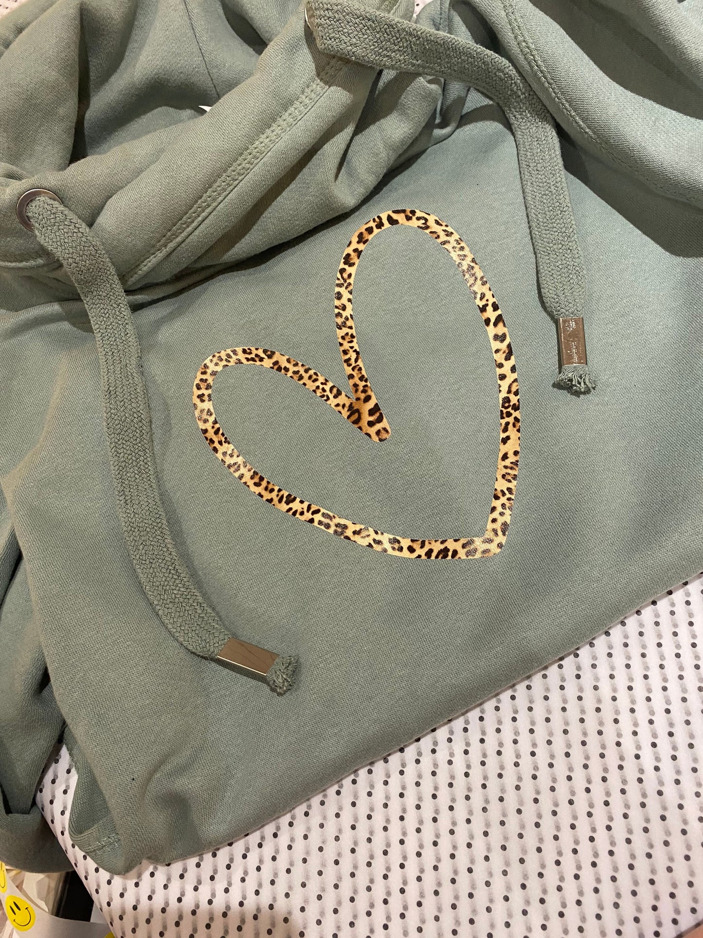 Cowl neck hoodie in orange with leopard heart print